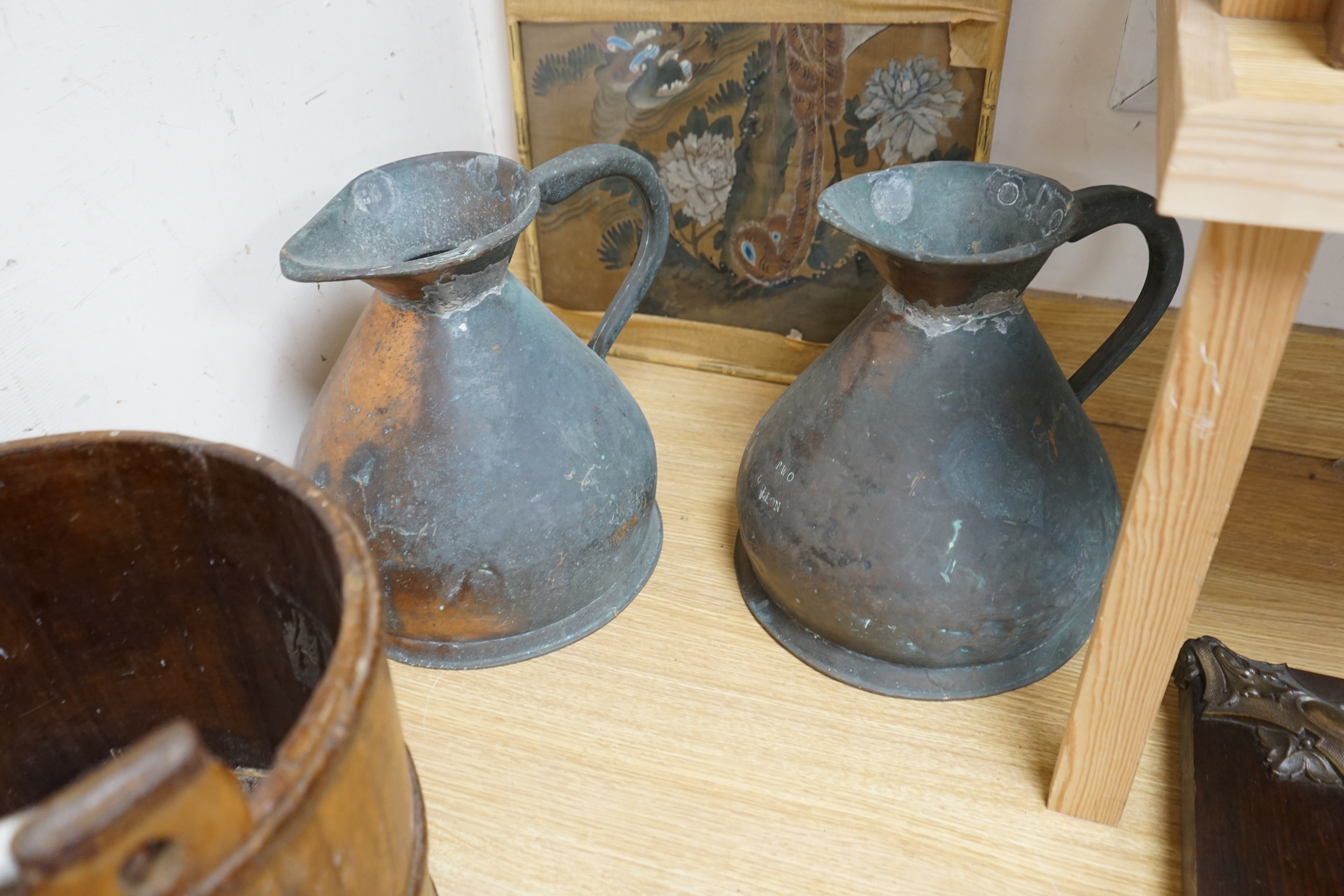 Two Victorian two gallon copper haystack measures and a wooden well bucket, Tallest 35cm